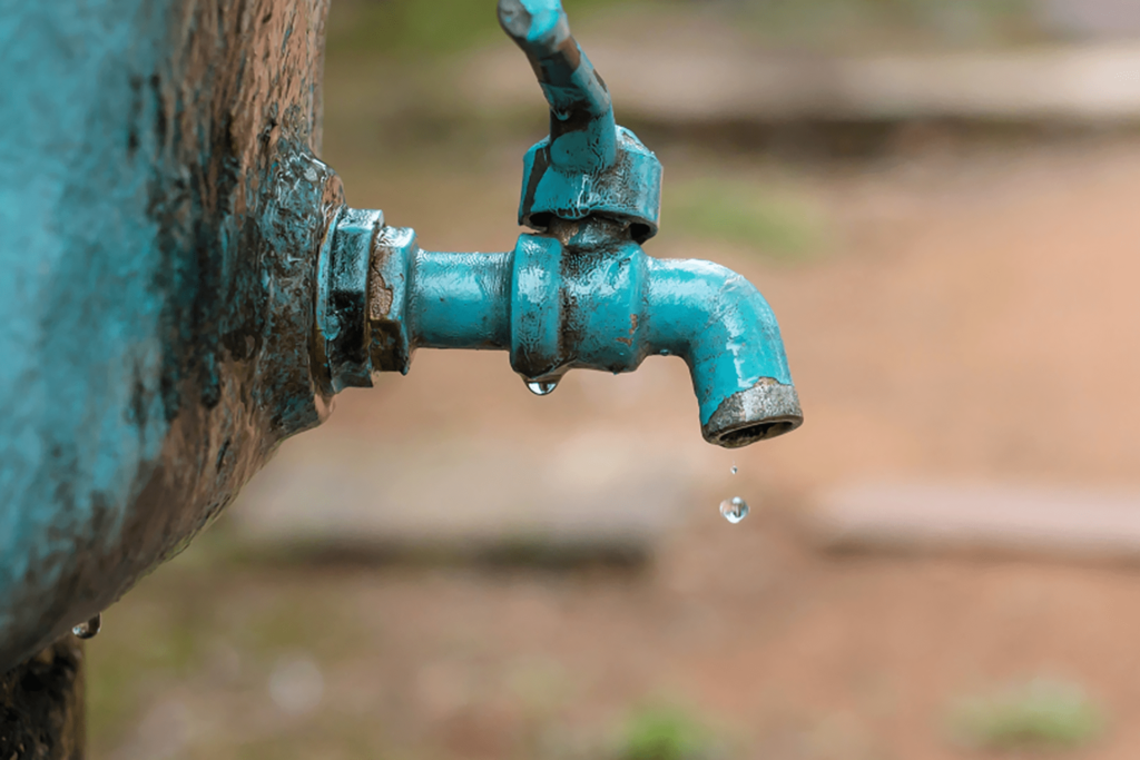 Why is fluoride added to tap water and what is the safe amount?