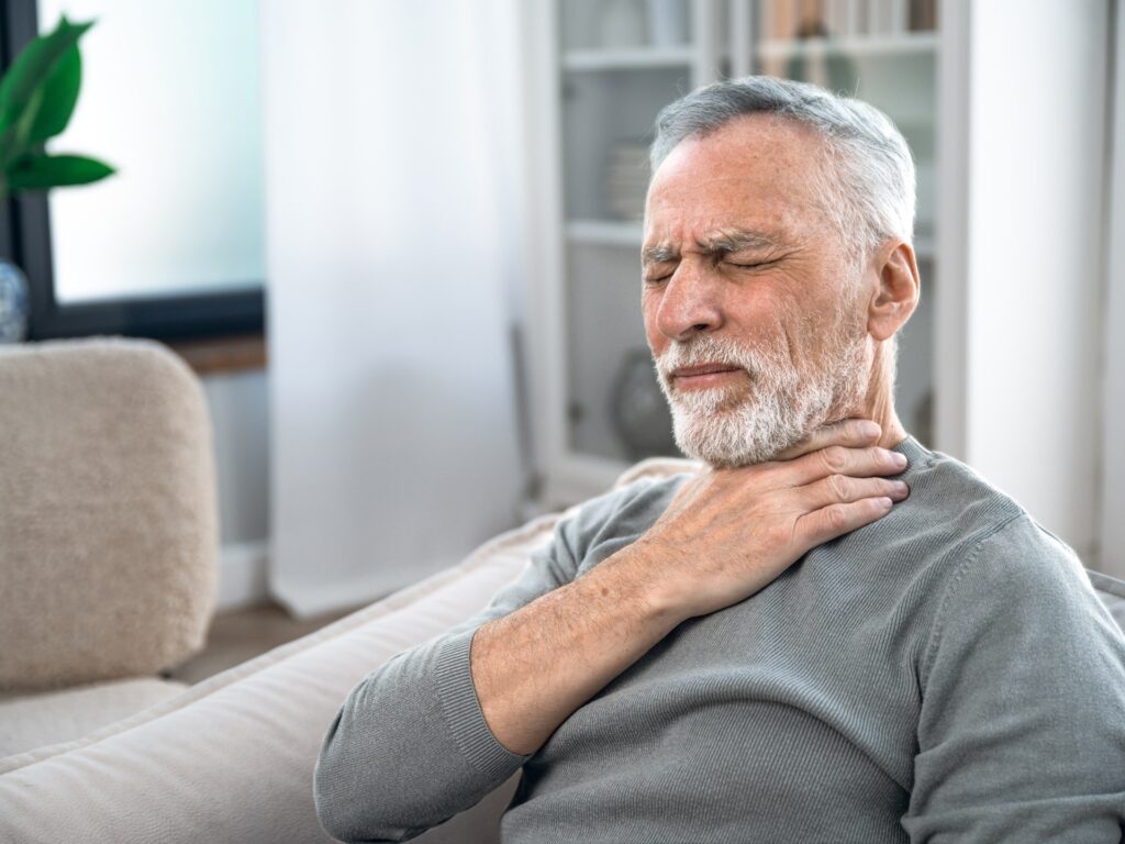 Repeated choking after burping food indicates this disease