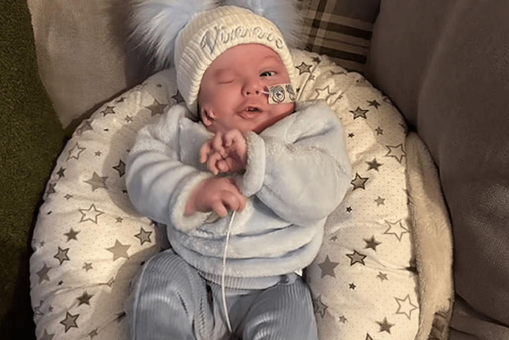 A child born and his ear on his cheek, what is his story?