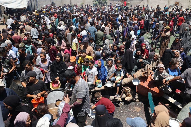 Palestinians Gather at a Food Distribution Point in the Nuseirat Refugee Camp in the Center Gaza Strip on JULY 19, 2025.