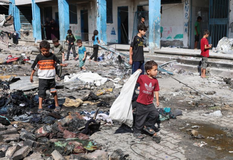 Palestinian Children Walk, Near the Site of An Overnight Israeli Strike on a School Sheltering Displaced People, in Bureij Refugee Camp, in the center gaza stream, JULY 8, 2025. Reuters/Ramadan Abed