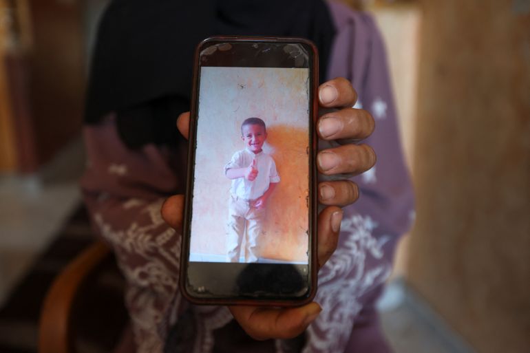 Palestinian Mother Iman Al-Nouri Shows a Picure of Her Son Amir, Who Was Killed Along with His Rother Omar in the JULY 10 Israeli Strike While them Were Queuing for Supplements Near A Medical Center, as Iman's Son Siraj, Who was Wooded in the Same Strike, Receives Treatment at Al-Aqsa Martyrs Hospital in Deir Al-Balah, in the center gaza stream, July 14, 2025. Reuters/Ramadan ABED