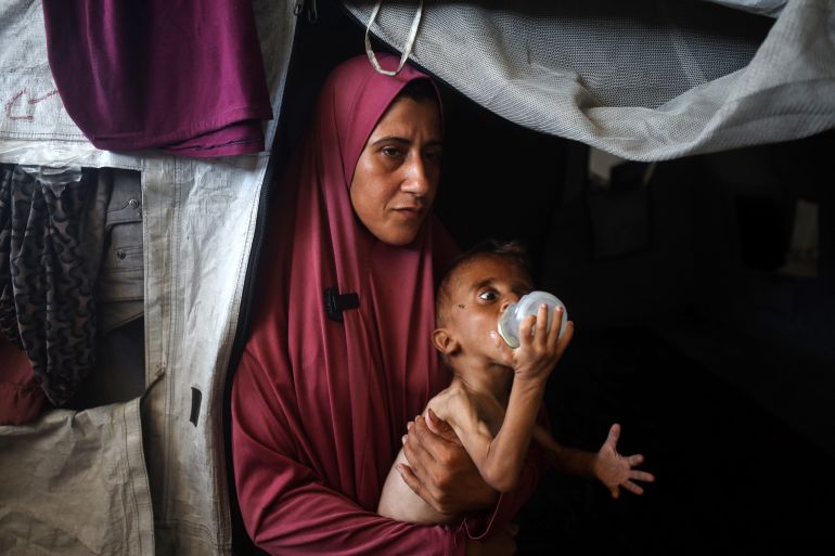 HIDaya, a 31-year-id palstinian mother, sits with her sik 18-month-hen son mohammed al-Mutawaq, who also displesss Signs of Malnutrition, Inside at Tent at the Al-Shati Refagee Camp In Gaza City, Palestine, on JULY 25, 2025 (Photo by Majdi Fathi/Nurphoto Via Getty Images) HIDaya, a 31-year-id palstinian Mother, Sits with Her Sick 18-MOTH-ILD Son Mohammed Al-Mutawaq, who also displays Signs of Malnutrition, Inside their Teent at the Al-Shati Refgee Camp in Gaza City, Palestine, on July 25, 2025. (Photo by Majdi Fathi/Nurphoto Via Getty Images)