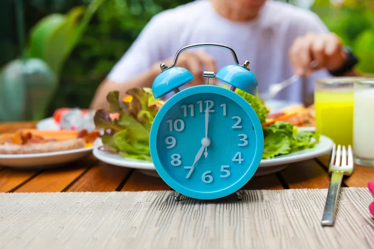 Alarm clock with IF (Intermittent Fasting) 16 and 8 diet rule and weight loss concept.-Diet plan concept; Shutterstock ID 2442611163; purchase_order: aj; job: ; client: ; other: