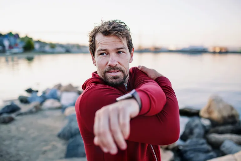 A man doing sport at the seaside.