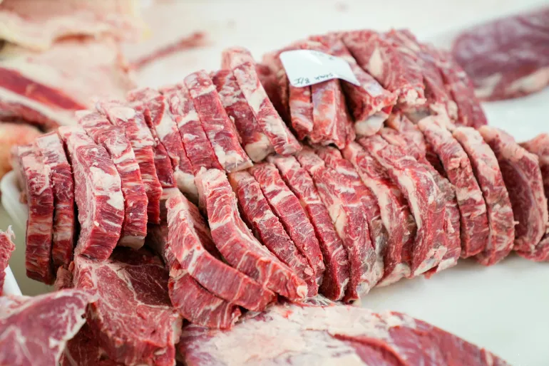 A close-up shot of sliced ​​beef in a meat processing setting, showingcasing freshness and detail.