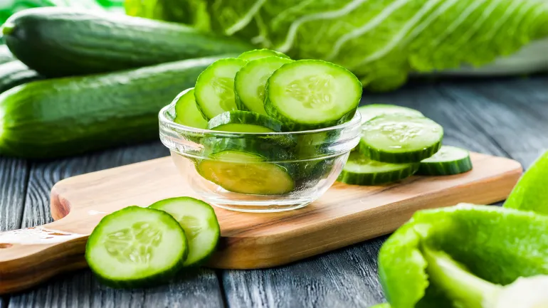 Fresh cucumber sliced ​​in a plate on table video cover shutterstock_1254891673