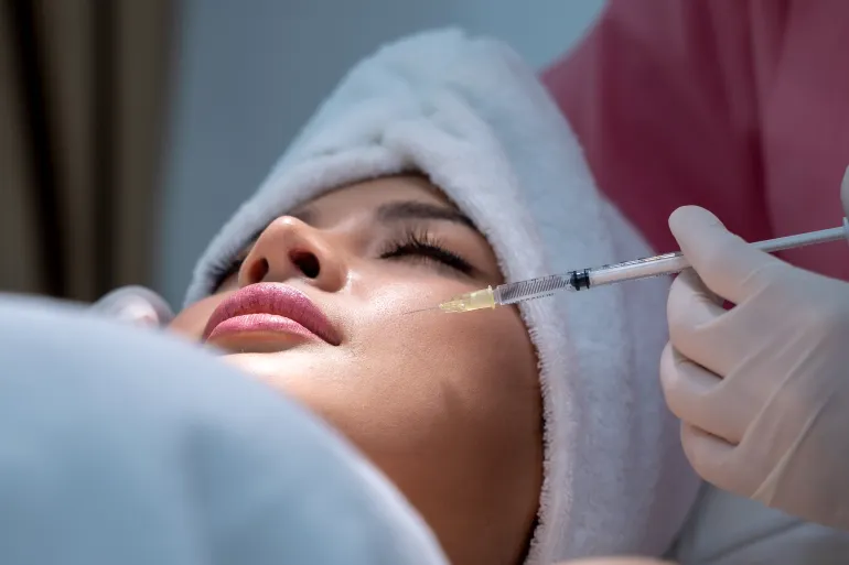 Beauty treatment with hyaluronic collagen injection, Young woman has a Botox injections, Cosmetology and skin care, Plastic surgery clinic.