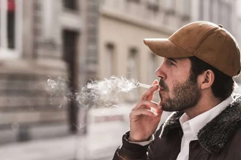 Carbon monoxide in cigarette smoke binds to hemoglobin and reduces its ability to transport oxygen efficiently