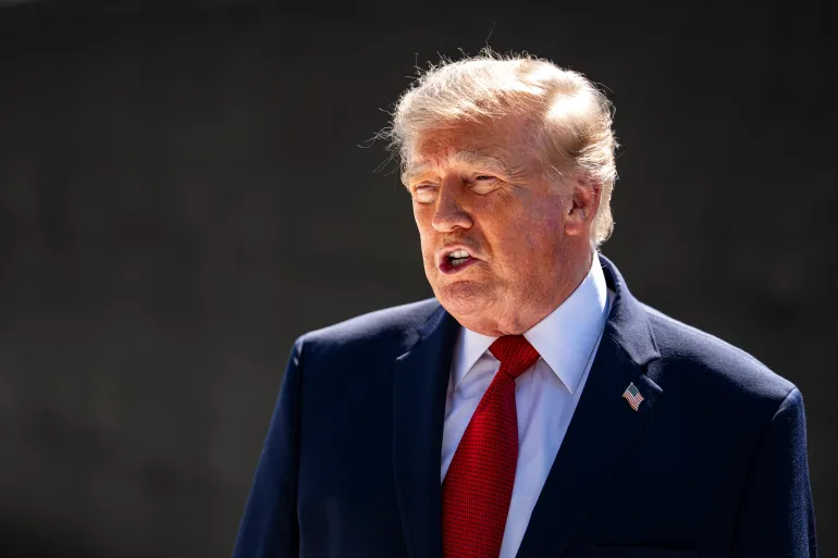 WASHINGTON, DC - AUGUST 19: US President Donald Trump speaks to members of the media while touring construction of the new White House helipad and driveway on the South Lawn of the White House on Aug. 19, 2026 in Washington, DC. (Photo by Al Drago/Getty Images)