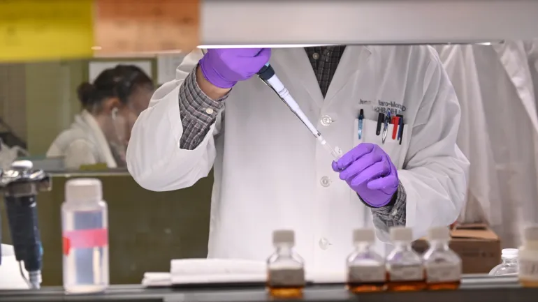 A researcher works in Dr. John Tisdale's lab at the National Institutes of Health after the agency announced a breakthrough in sickle cell anemia research in Bethesda, US March 11, 2019. REUTERS/Erin Scott