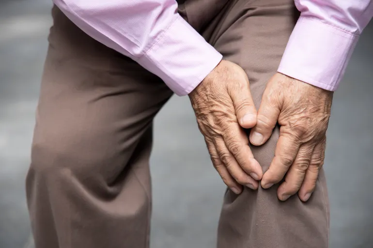 sick old senior man suffering from knee pain, knee joint injury, gout, rheumatoid, arthritis, osteoporosis, concept of accessibility or a11y; Shutterstock ID 1802468869; purchase_order: aj; job: ; client: ; other: