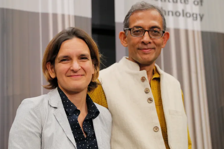 Abhijit Banerjee and Esther Duflo, two of the three winners of the 2019 Nobel Prize in Economics, stand together at a news conference at the Massachusetts Institute of Technology (MIT) in Cambridge, Massachusetts, US, October 14, 2019. REUTERS/Brian Snyder
